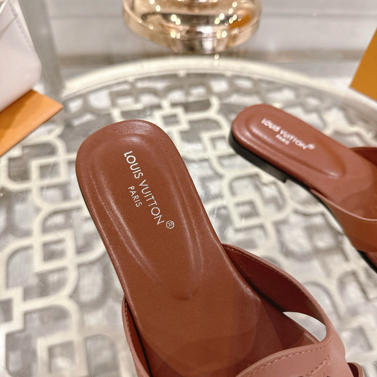 ISOLA FLAT SLIDE IN PENNY BROWN CALFSKIN